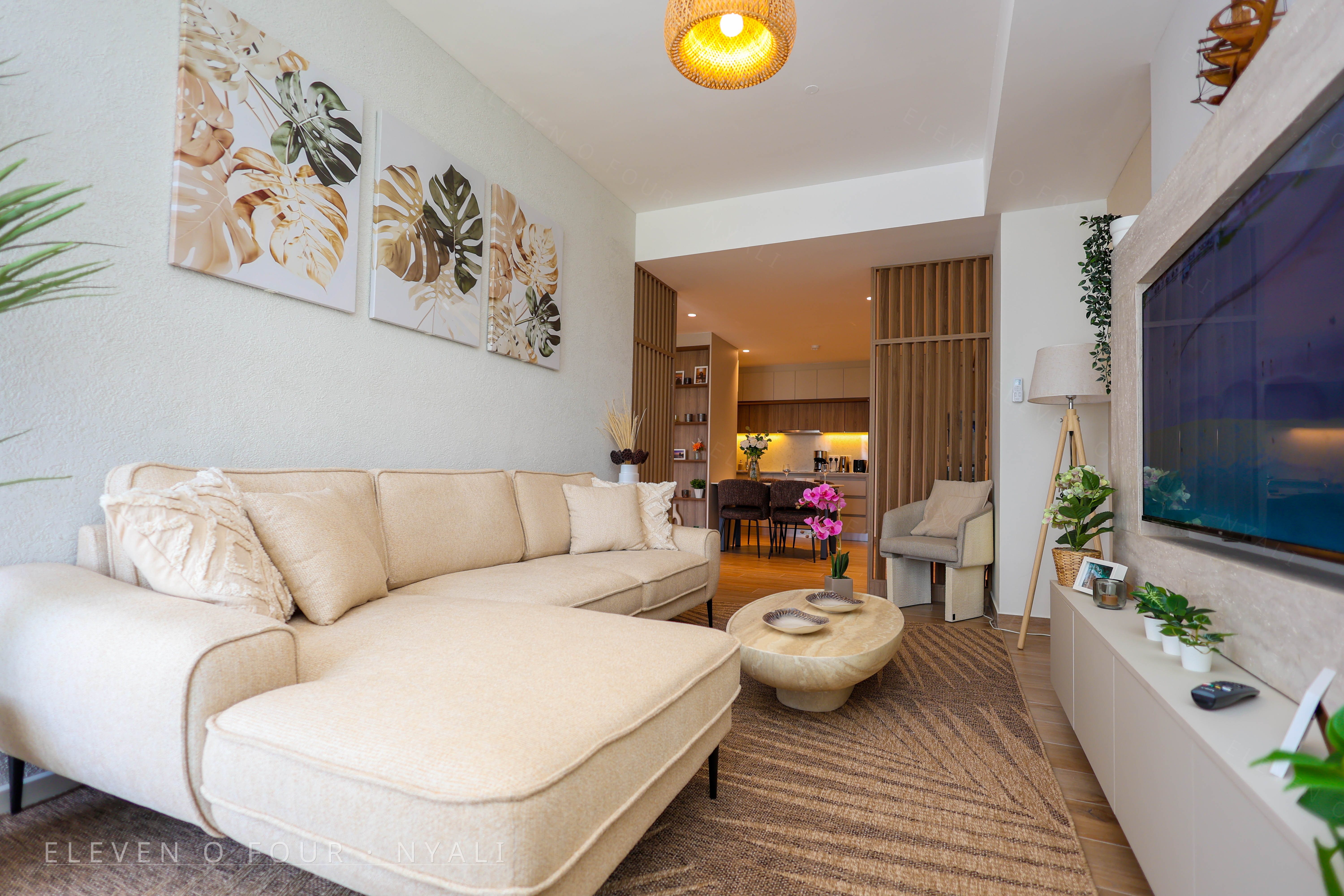 Spacious lounge with sofa and television